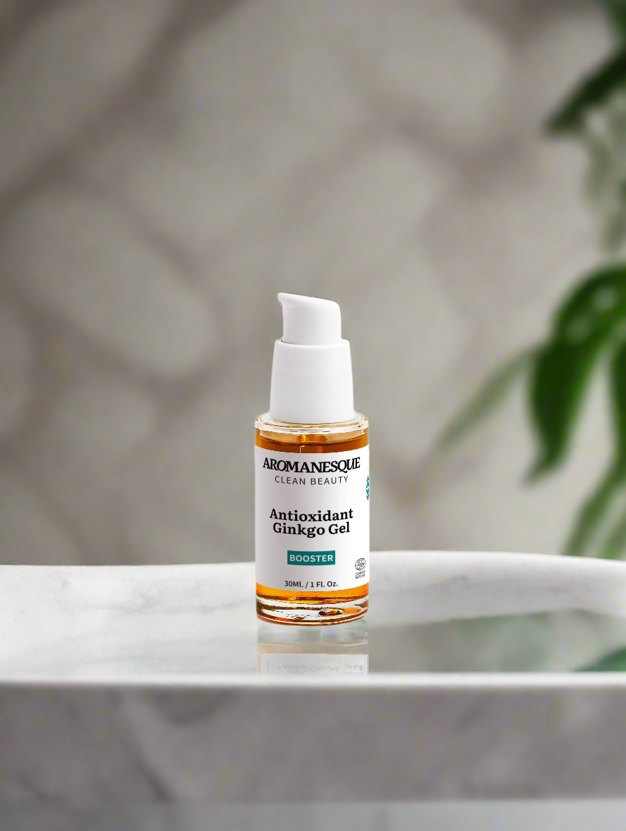 A bottle of Arbonne Antioxidant Ginkgo Gel on a marble surface with a blurred background